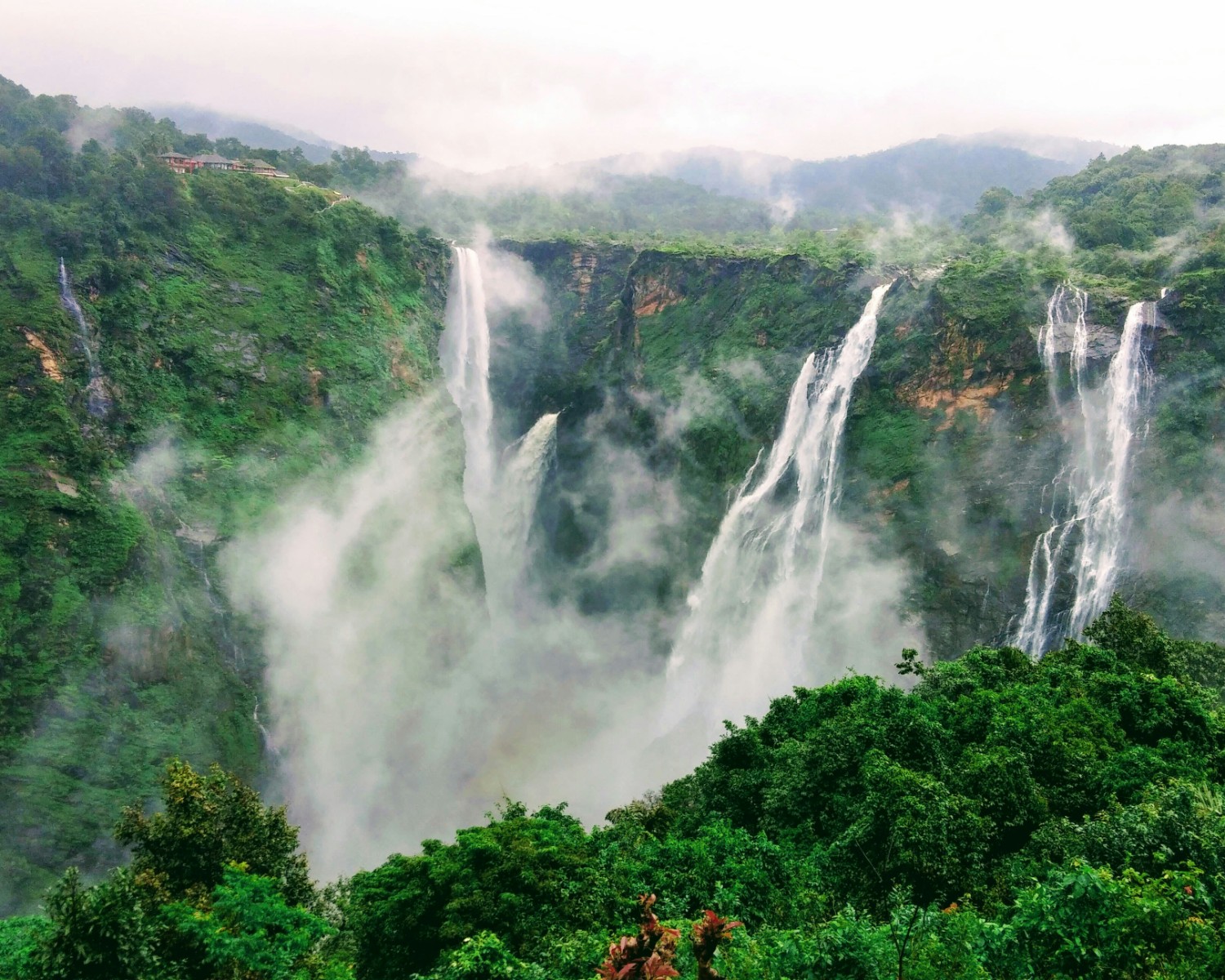 Nuranang Falls cascading into emerald pool
