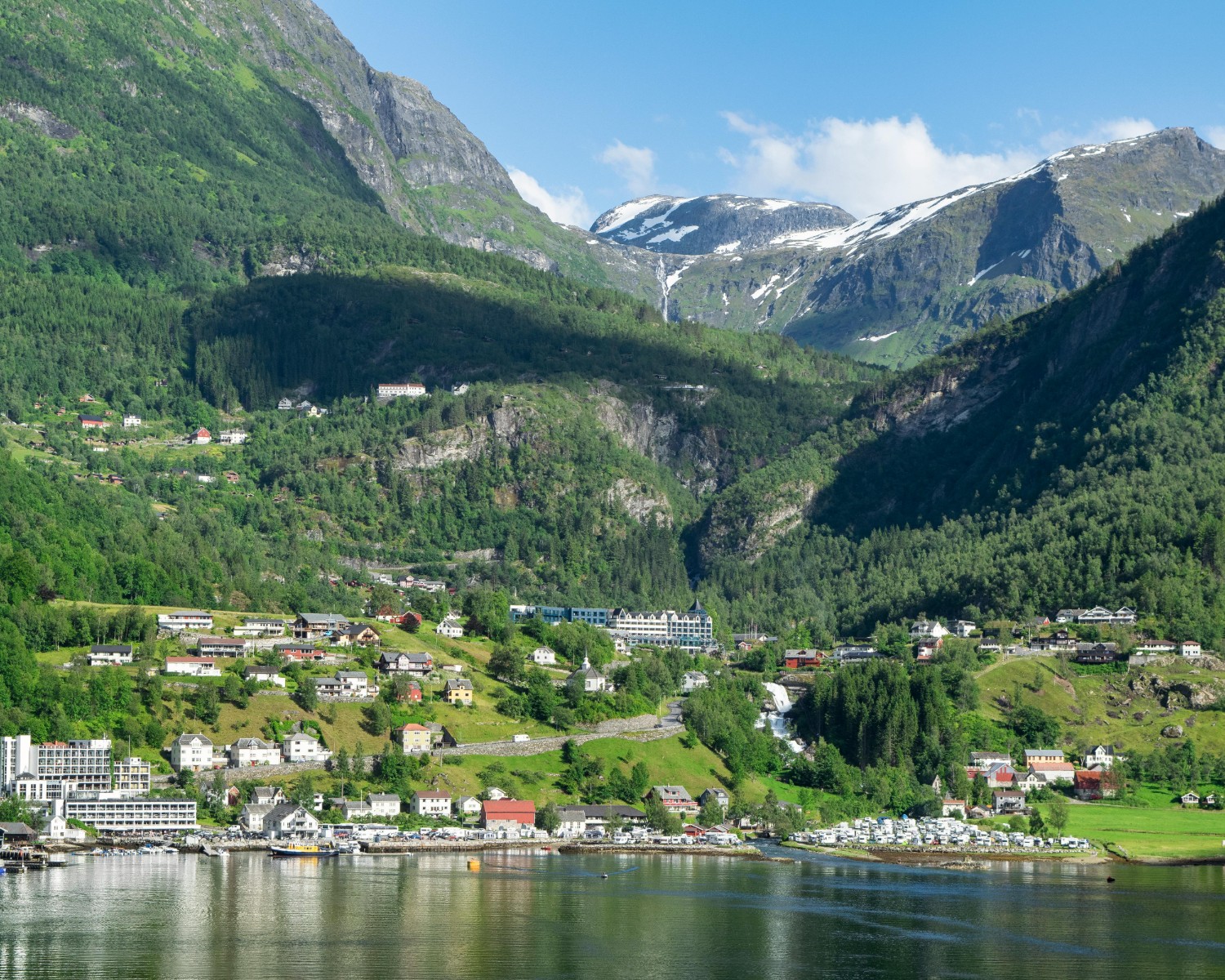 Sheer cliff walls of Geirangerfjord in summer daylight