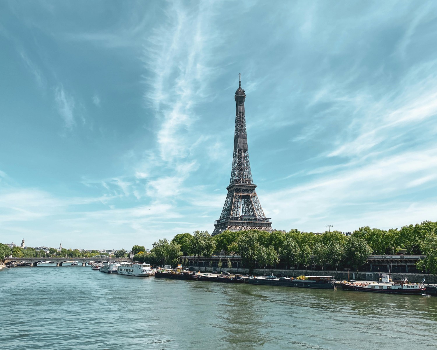 Eiffel Tower illuminated at sunset—Paris's most iconic monument